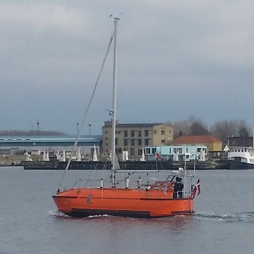 A sailboat made out of a lifeboat.